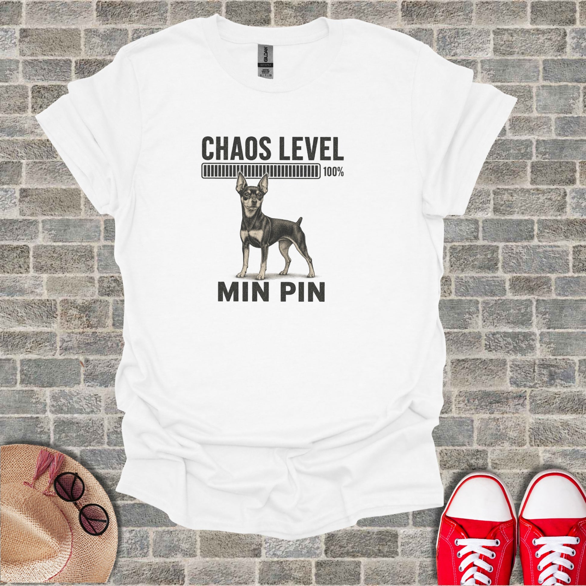 White t-shirt with "Chaos Level 100%" and "MIN PIN" featuring a mini pinscher dog.