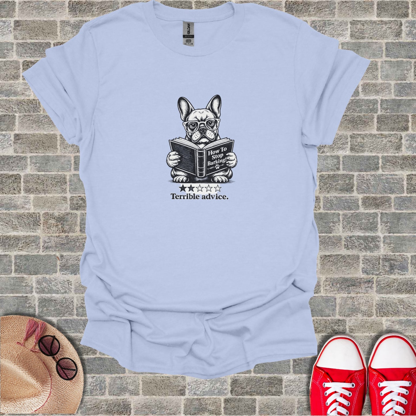 French bulldog in glasses reading "How to Stop Barking" book.
