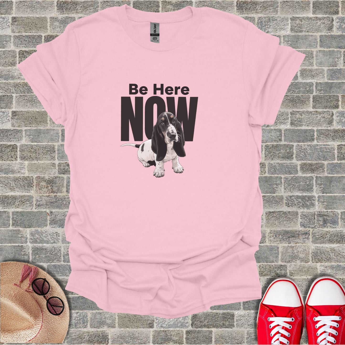Pink t-shirt with Basset Hound and "Be Here NOW" text.