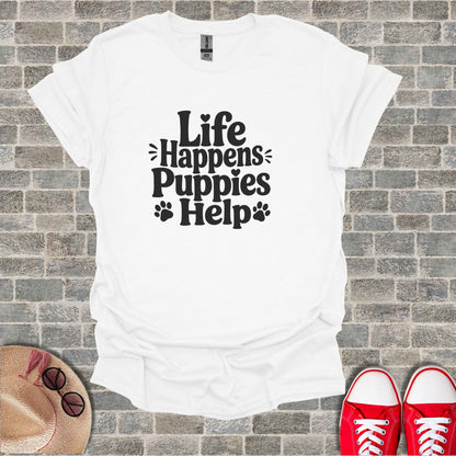 White t-shirt with "Life Happens Puppies Help" text and paw prints.