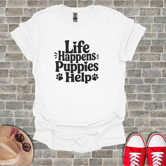 White t-shirt with "Life Happens Puppies Help" text and paw prints.