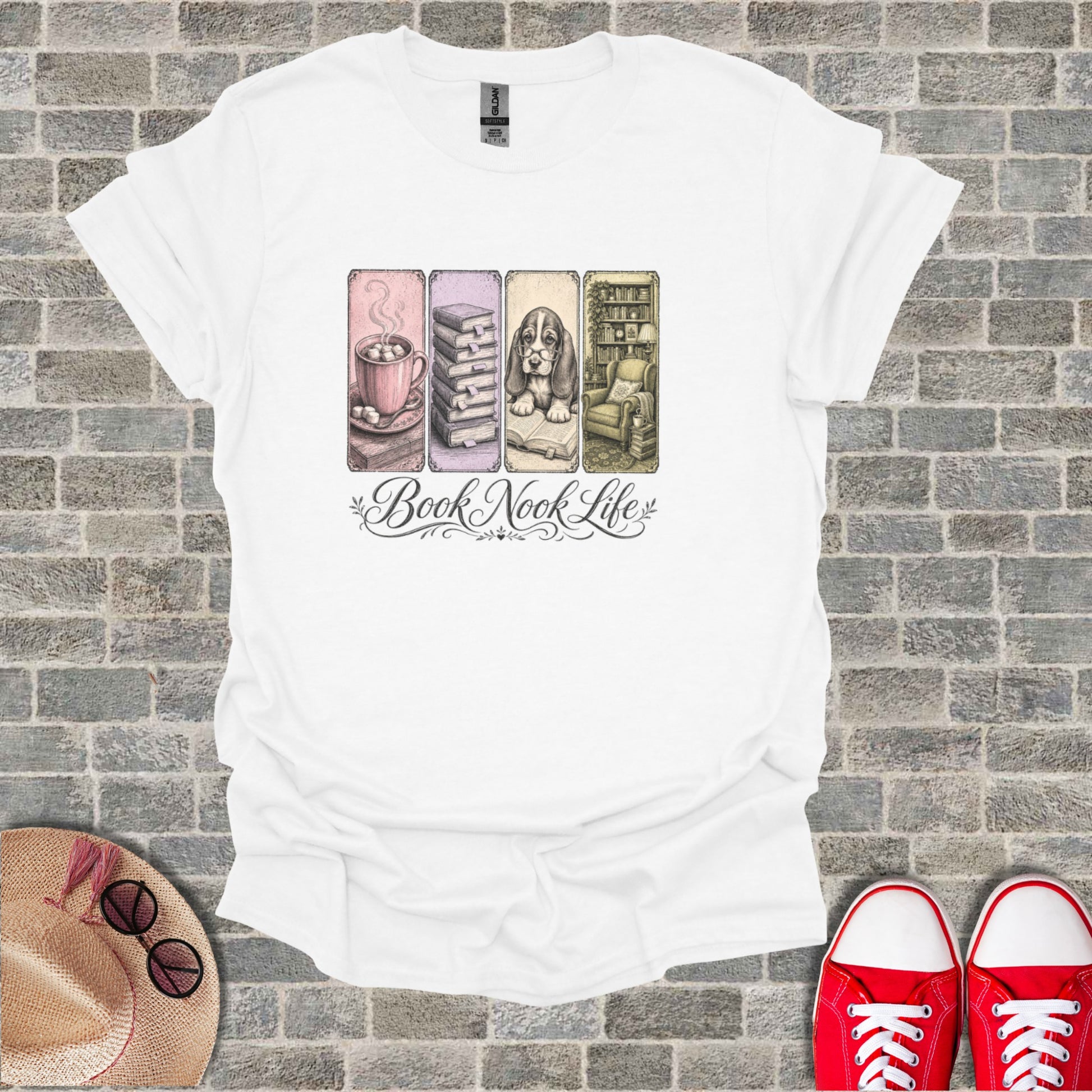 White t-shirt with four hand-drawn panels: coffee, books, armchair, and text "Book Nook Life."