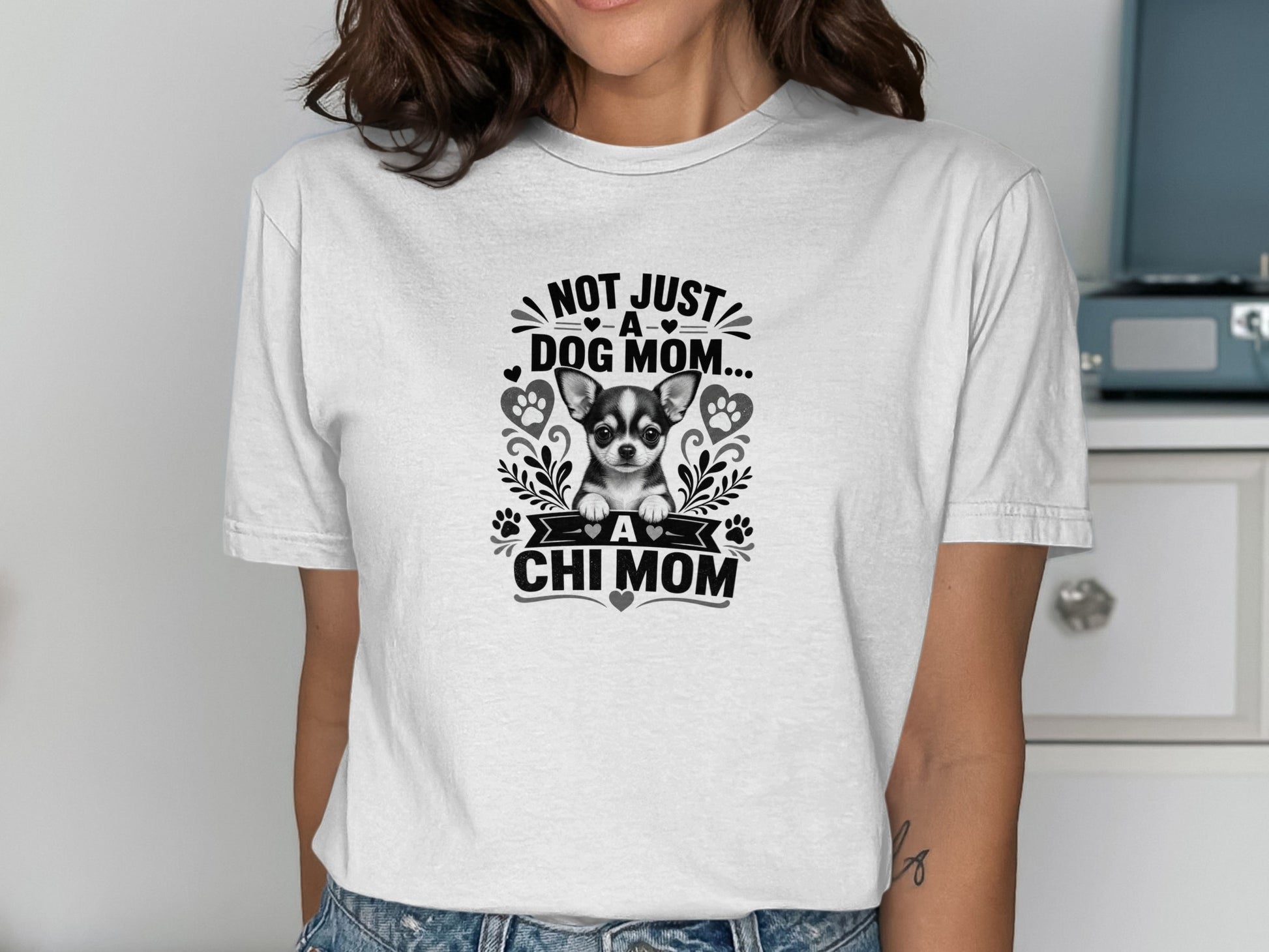 White t-shirt with black graphic: "Not Just a Dog Mom... A Chi Mom" featuring a chihuahua.