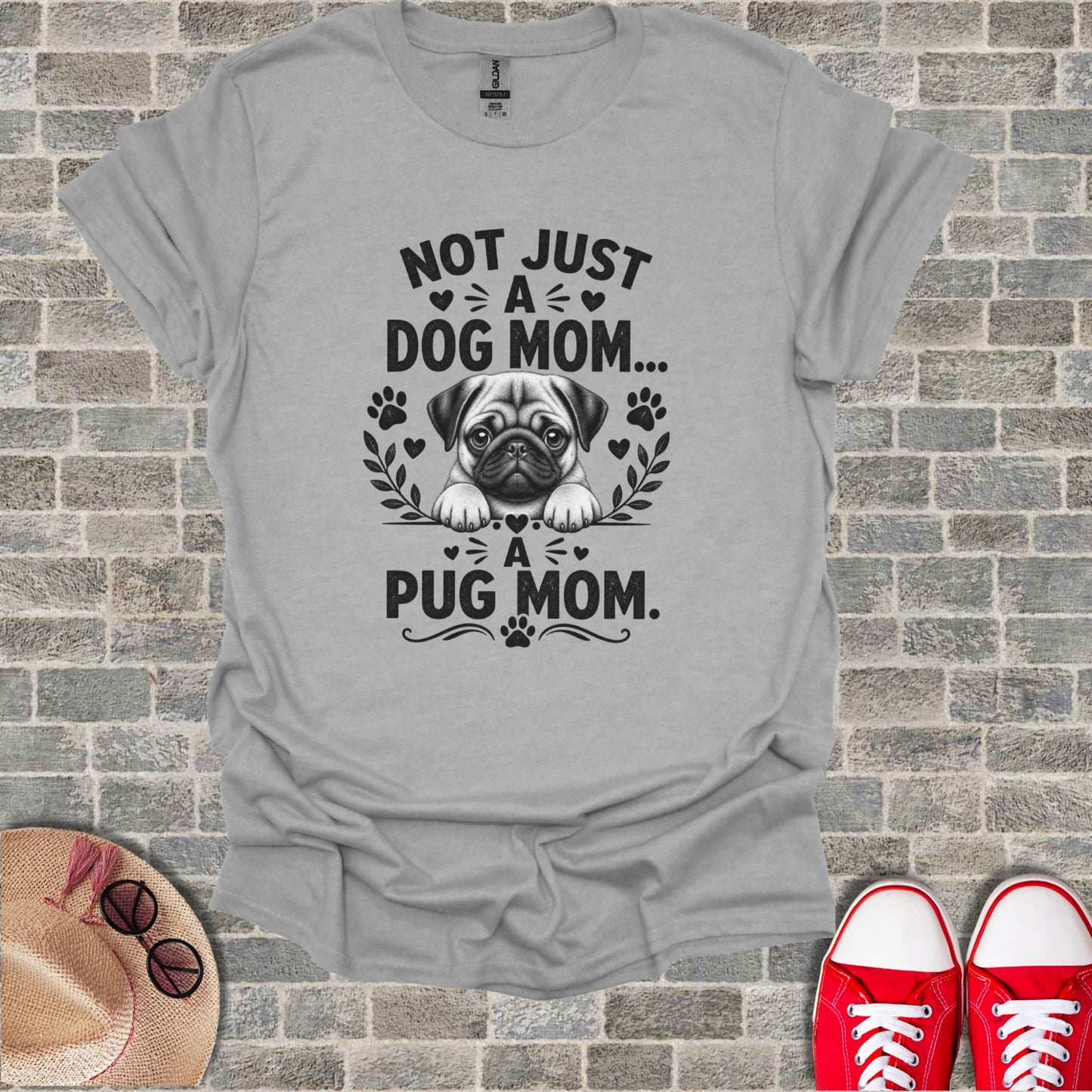 Grey t-shirt with "Not Just A Dog Mom... A Pug Mom." text and pug illustration.