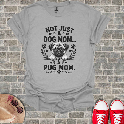 Grey t-shirt with "Not Just A Dog Mom... A Pug Mom." text and pug illustration.