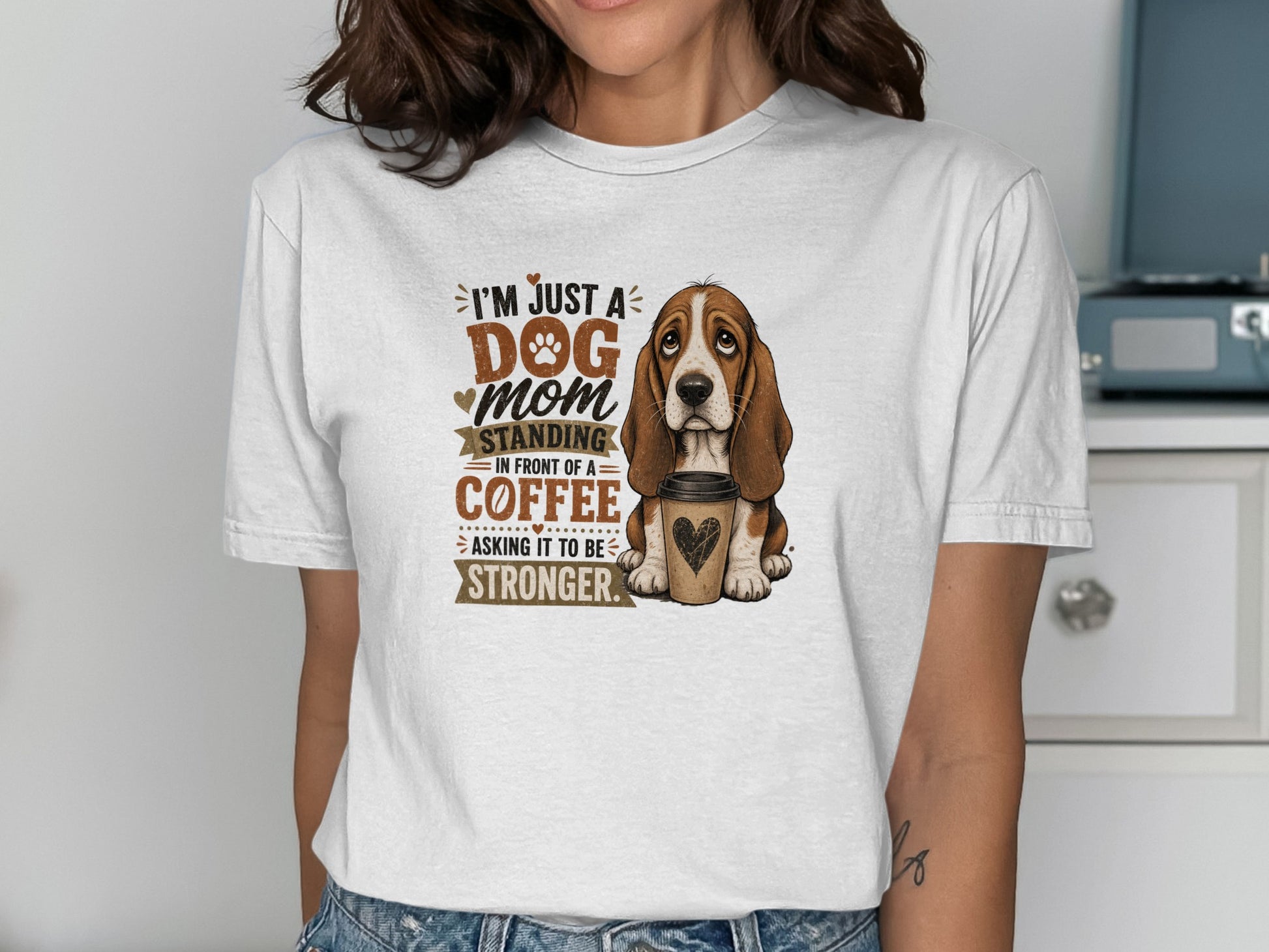Basset hound illustration on t-shirt with "Dog Mom" text and coffee.