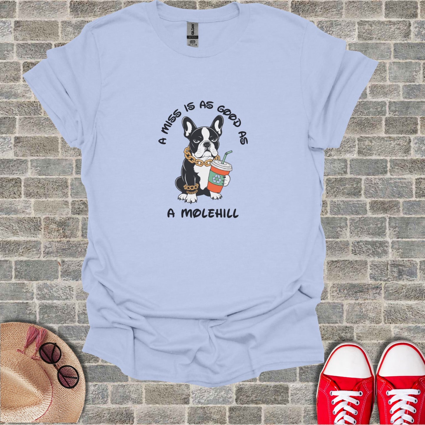 Light blue t-shirt with French bulldog wearing a gold chain and holding a coffee cup.