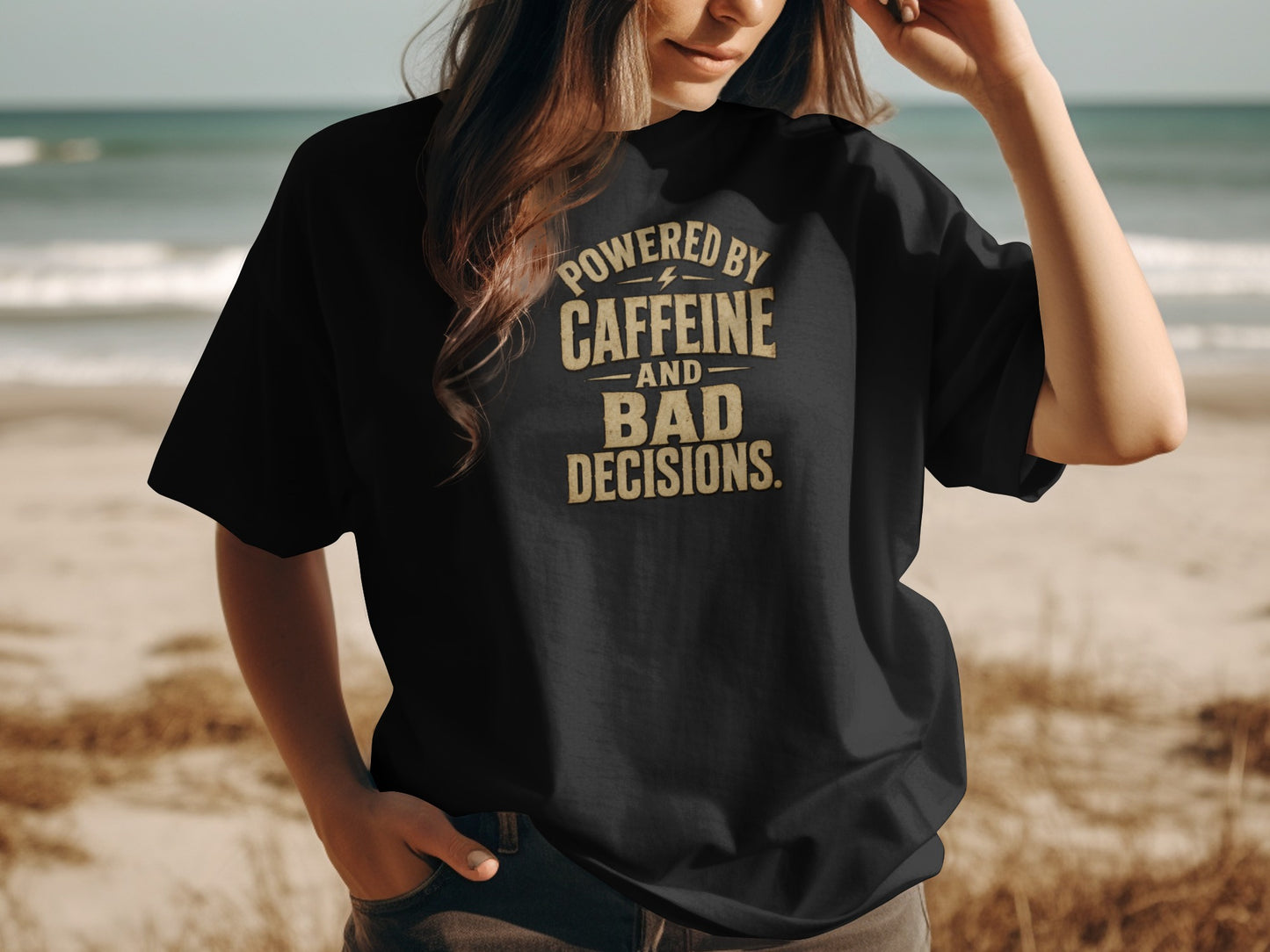 Black t-shirt with "POWERED BY CAFFEINE AND BAD DECISIONS." text.