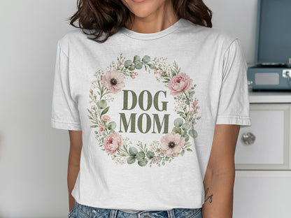 White t-shirt with "DOG MOM" text within a floral wreath design.