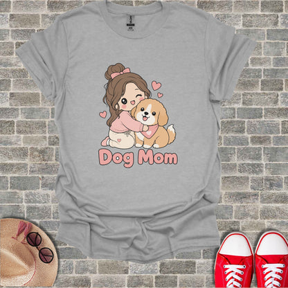 Gray t-shirt with illustration of a girl hugging a dog and text "Dog Mom."