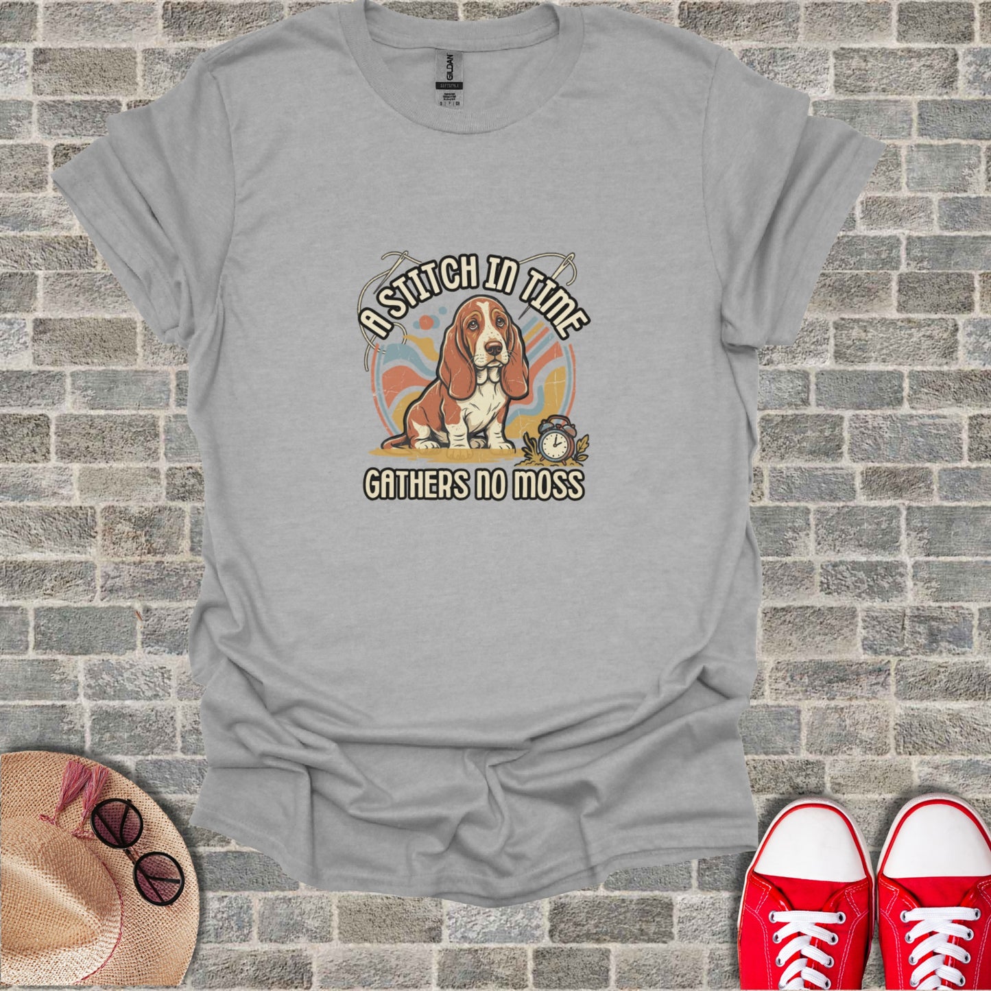 Basset hound wearing a watch and reading a book with "A stitch in time gathers no moss" text.