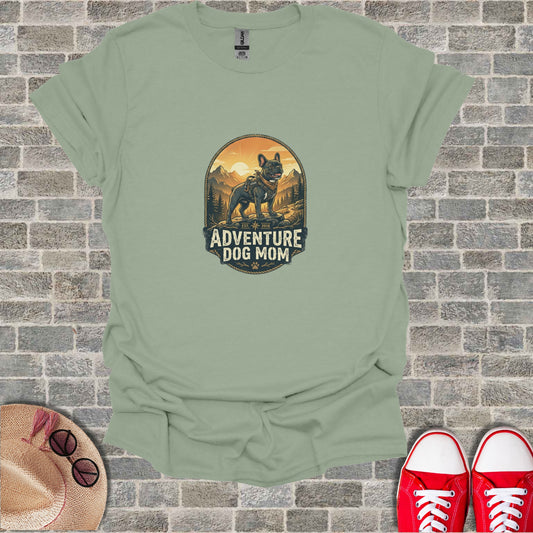 T-shirt graphic: French bulldog in mountain landscape, "Adventure Dog Mom" text.