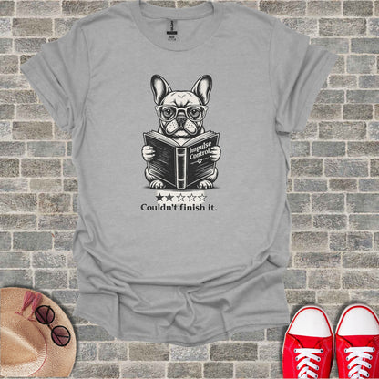 French bulldog in glasses reads book "Impulse Control," with stars and text "Couldn't finish it."