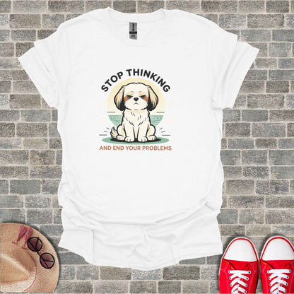 White t-shirt with a cartoon dog and text "STOP THINKING AND END YOUR PROBLEMS".
