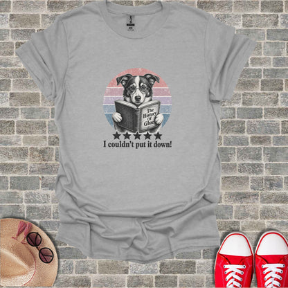 T-shirt with illustration of dog reading a book, "The History of Glue".