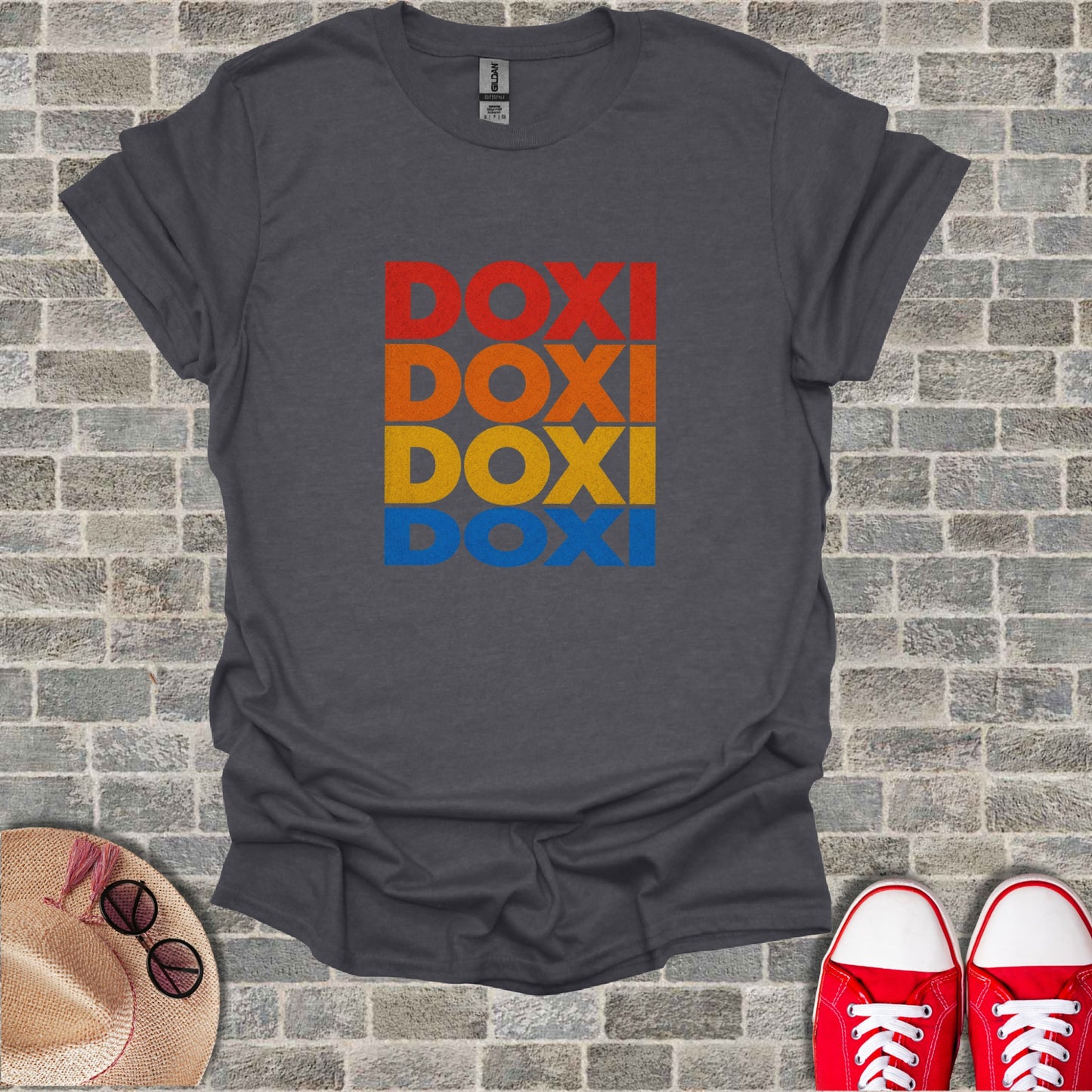 Dark grey t-shirt with "DOXI" in stacked red, orange, and blue text.