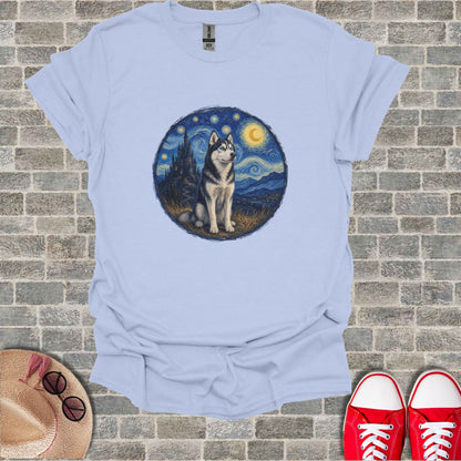 Husky in starry night landscape art on light blue t-shirt.