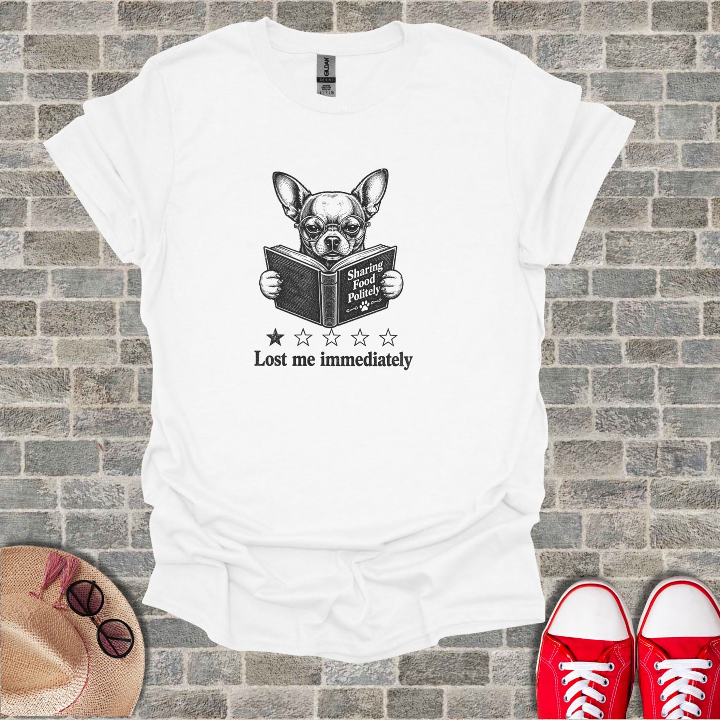 White t-shirt with chihuahua reading a book titled "Lost me immediately".