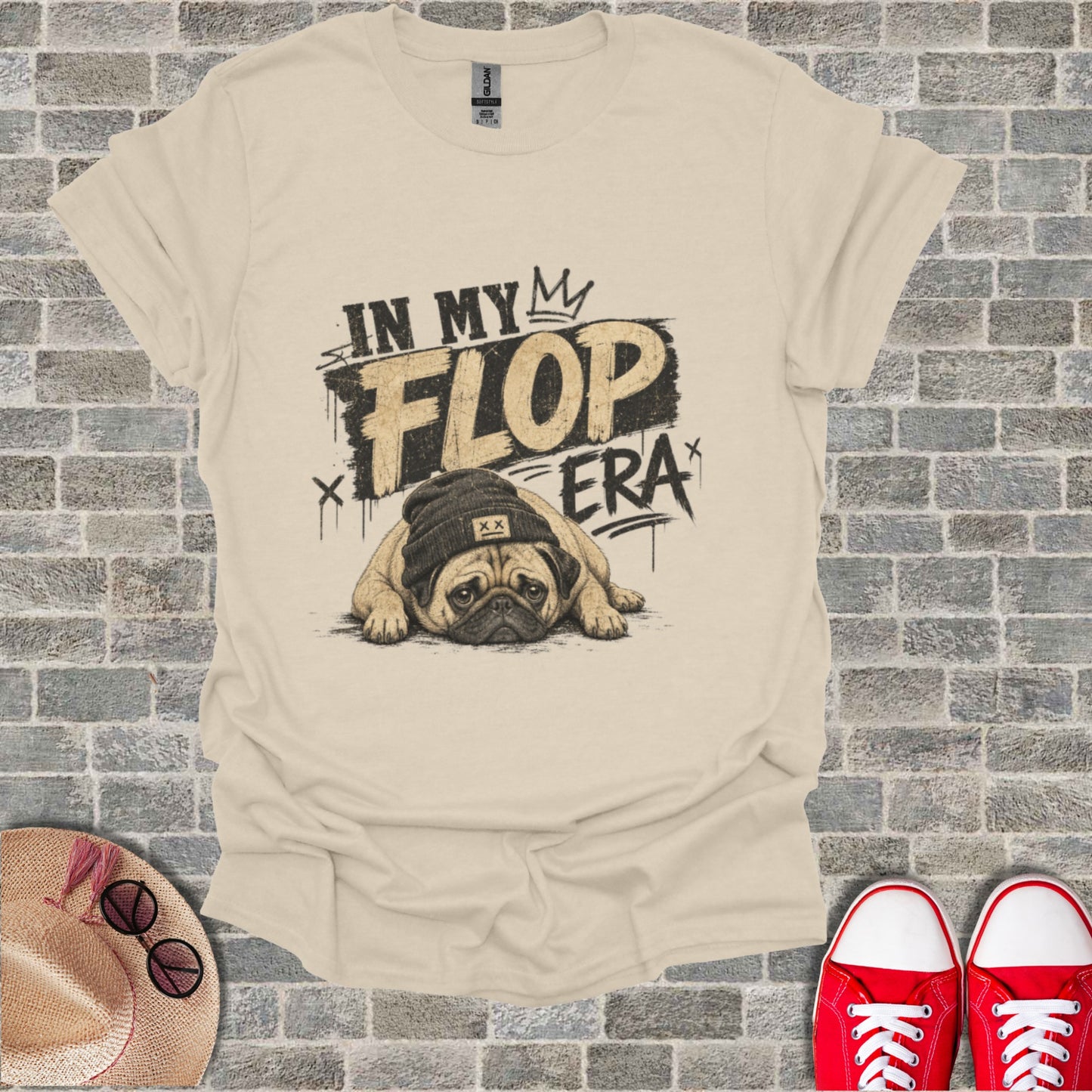 T-shirt with "IN MY FLOP ERA" text and a sad pug wearing a beanie.