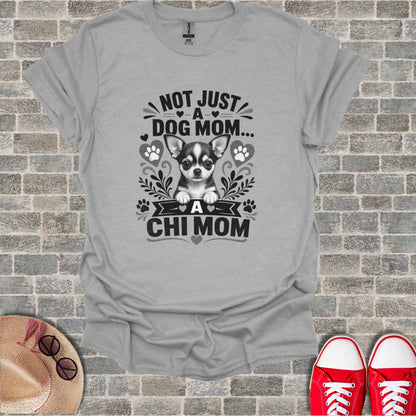 Grey t-shirt with a chihuahua graphic and text "Not Just a Dog Mom... A Chi Mom".