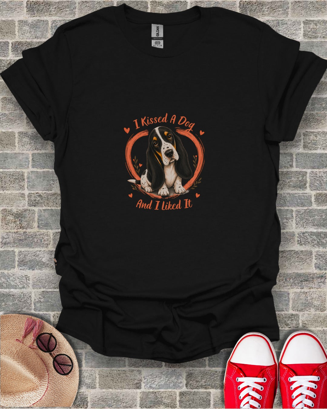 Black t-shirt with a Basset Hound illustration and text "I Kissed A Dog And I Liked It."