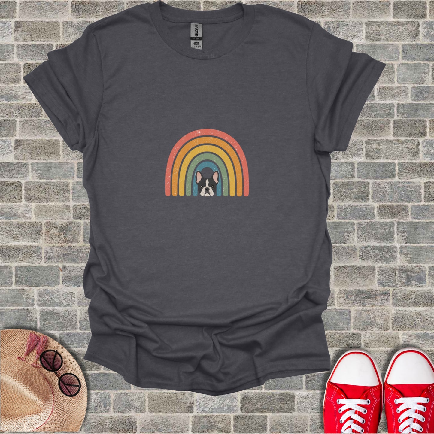 Dark gray t-shirt with a French bulldog peeking from behind a retro rainbow design.