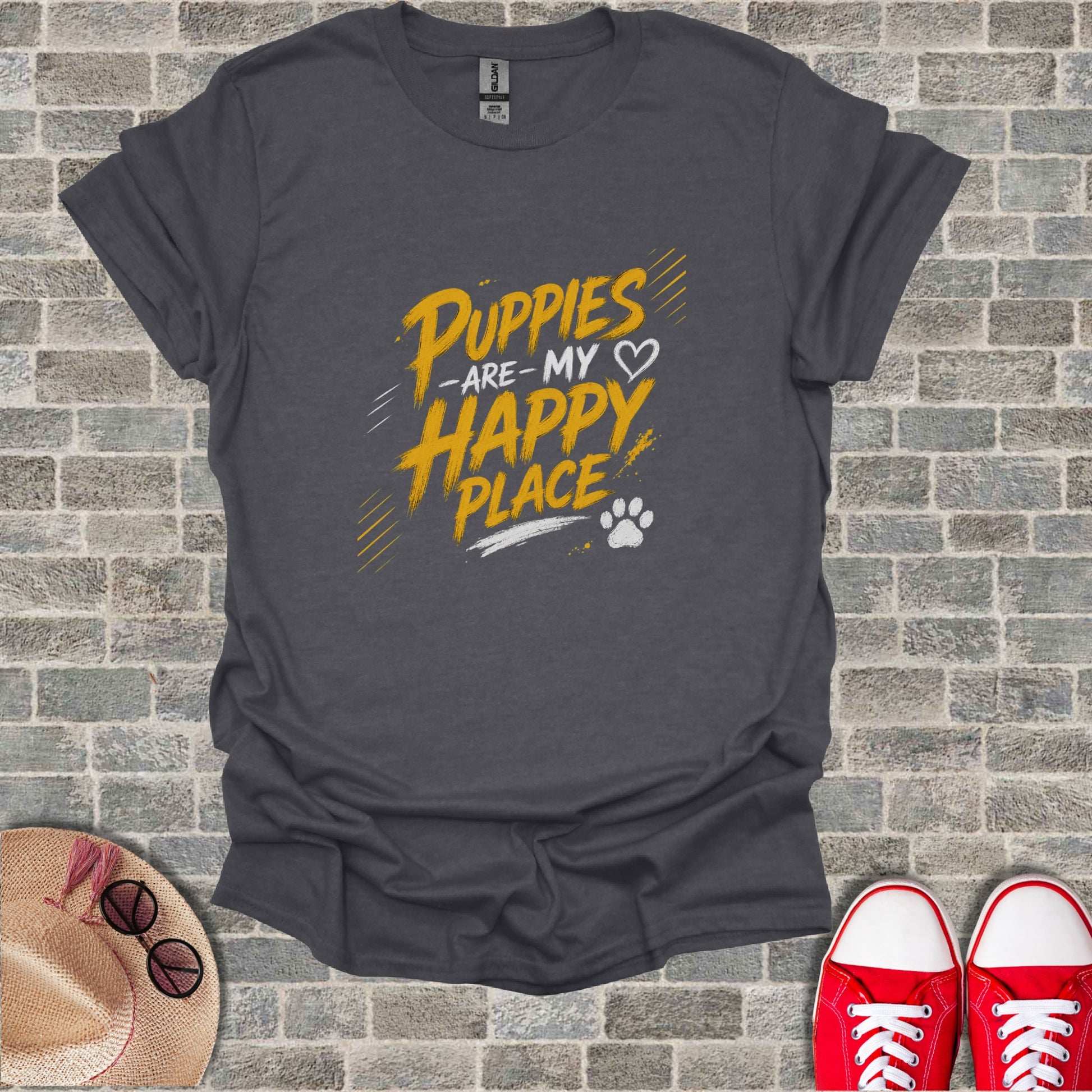 Dark gray t-shirt with yellow "Puppies are my happy place" text and paw print.