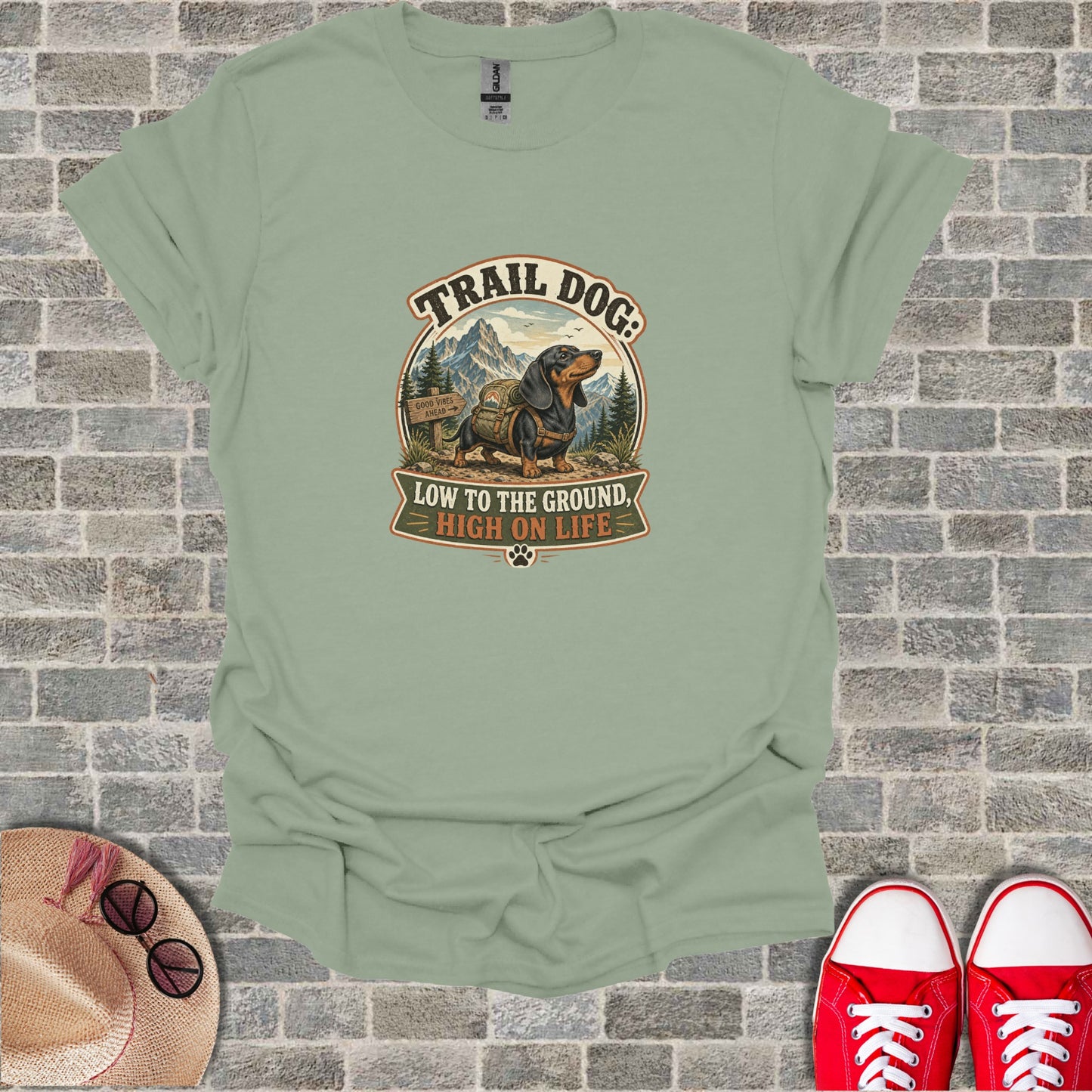 T-shirt with "Trail Dog: Low to the Ground, High on Life" text and dachshund graphic.