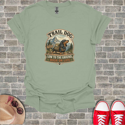 T-shirt with "Trail Dog: Low to the Ground, High on Life" text and dachshund graphic.