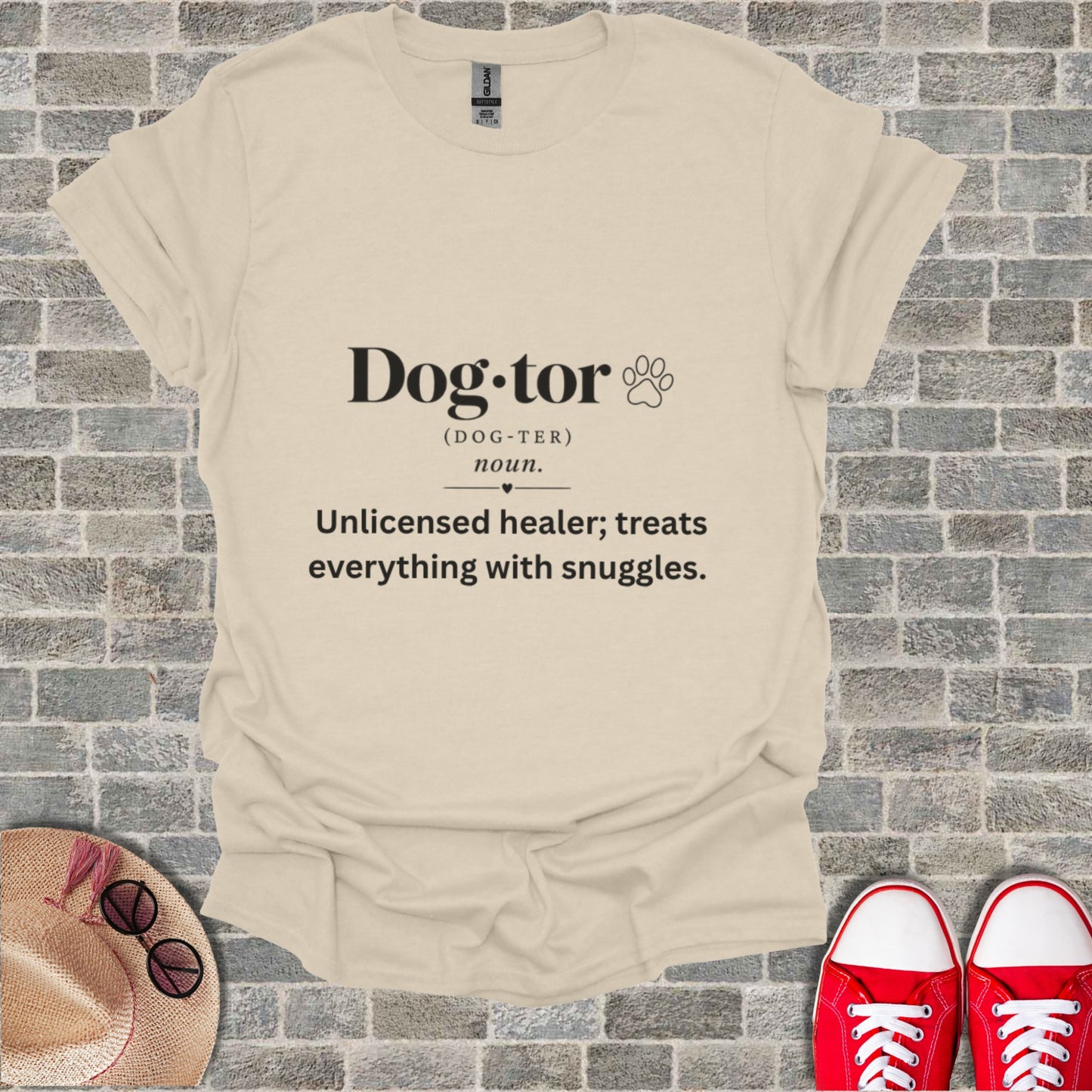 Cream t-shirt with "Dog-tor" definition: "Unlicensed healer; treats everything with snuggles."