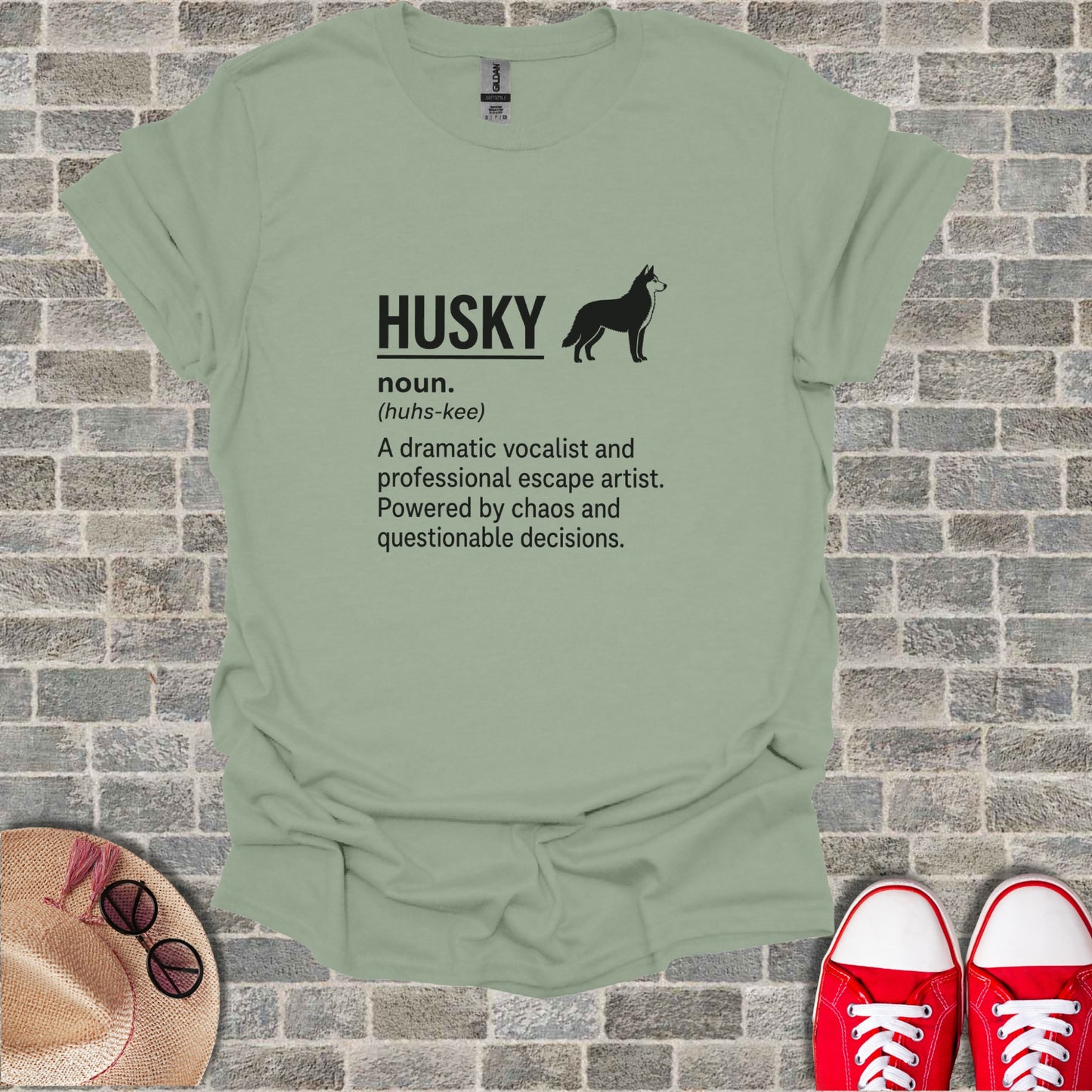 T-shirt with "Husky" definition: dramatic vocalist, escape artist, powered by chaos.