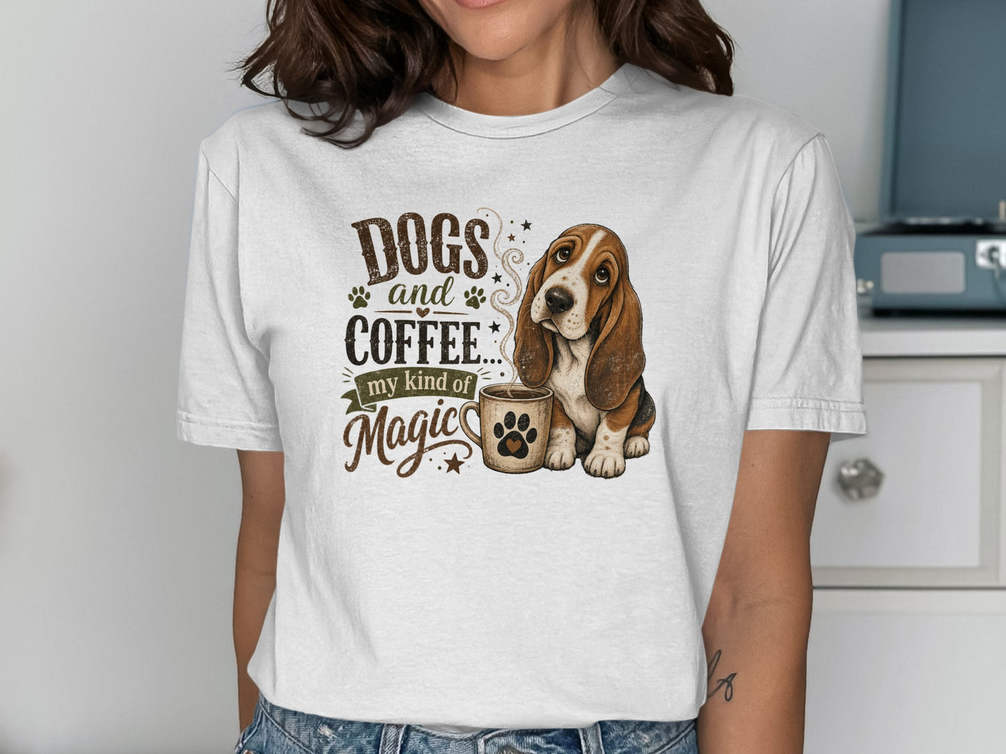 Basset hound with "Dogs and coffee... my kind of magic" text on a white t-shirt.