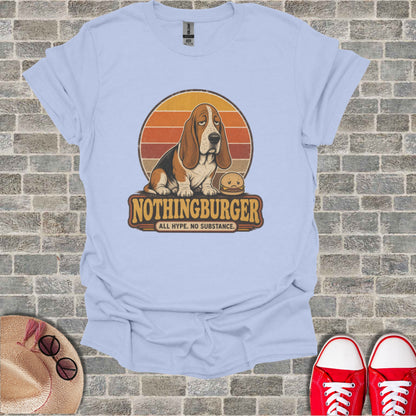 Light blue t-shirt with a Basset Hound sitting next to a hamburger with "NOTHINGBURGER" text.