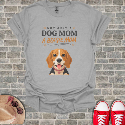 Grey t-shirt with beagle illustration and "Not Just a Dog Mom" text.