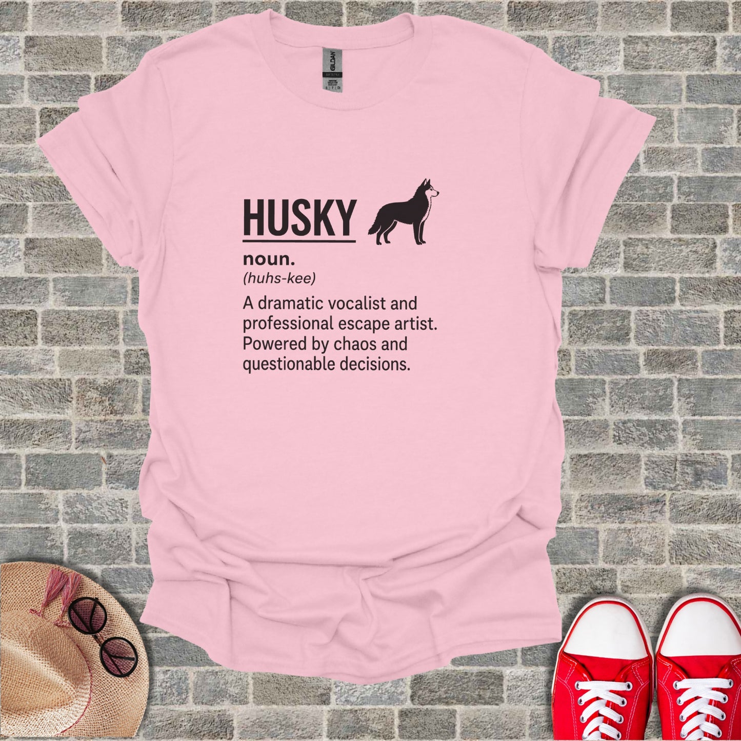 Pink t-shirt with black text and husky silhouette, reading "HUSKY (huhs-kee) A dramatic vocalist..."