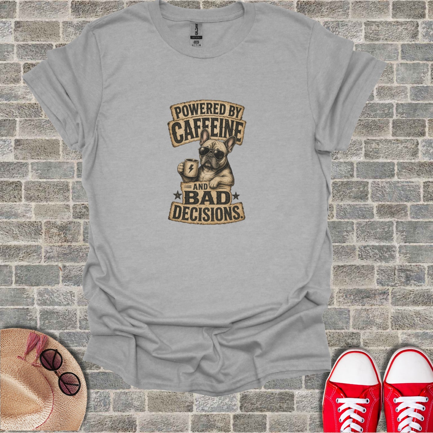 French bulldog with "Powered by Caffeine and Bad Decisions" text on a gray t-shirt.