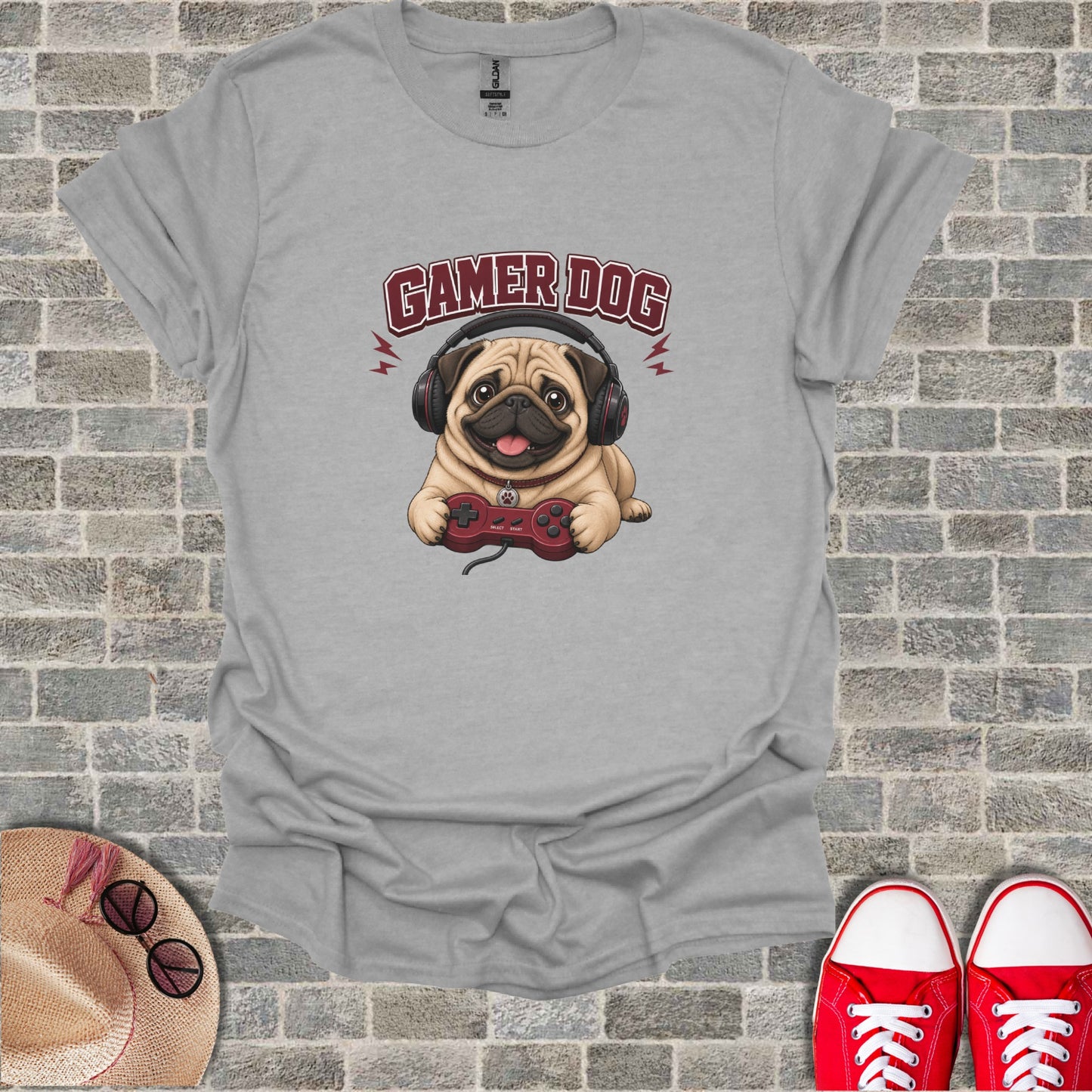 Grey t-shirt with a pug wearing headphones holding a video game controller.