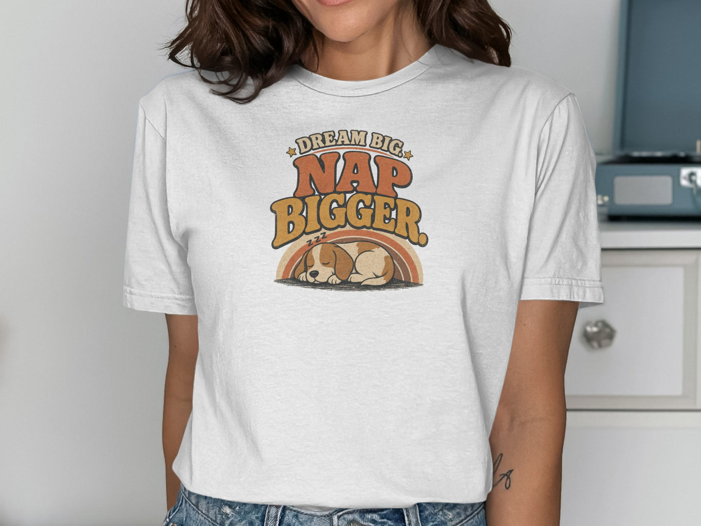 White t-shirt with "Dream Big Nap Bigger" text and sleeping puppy.