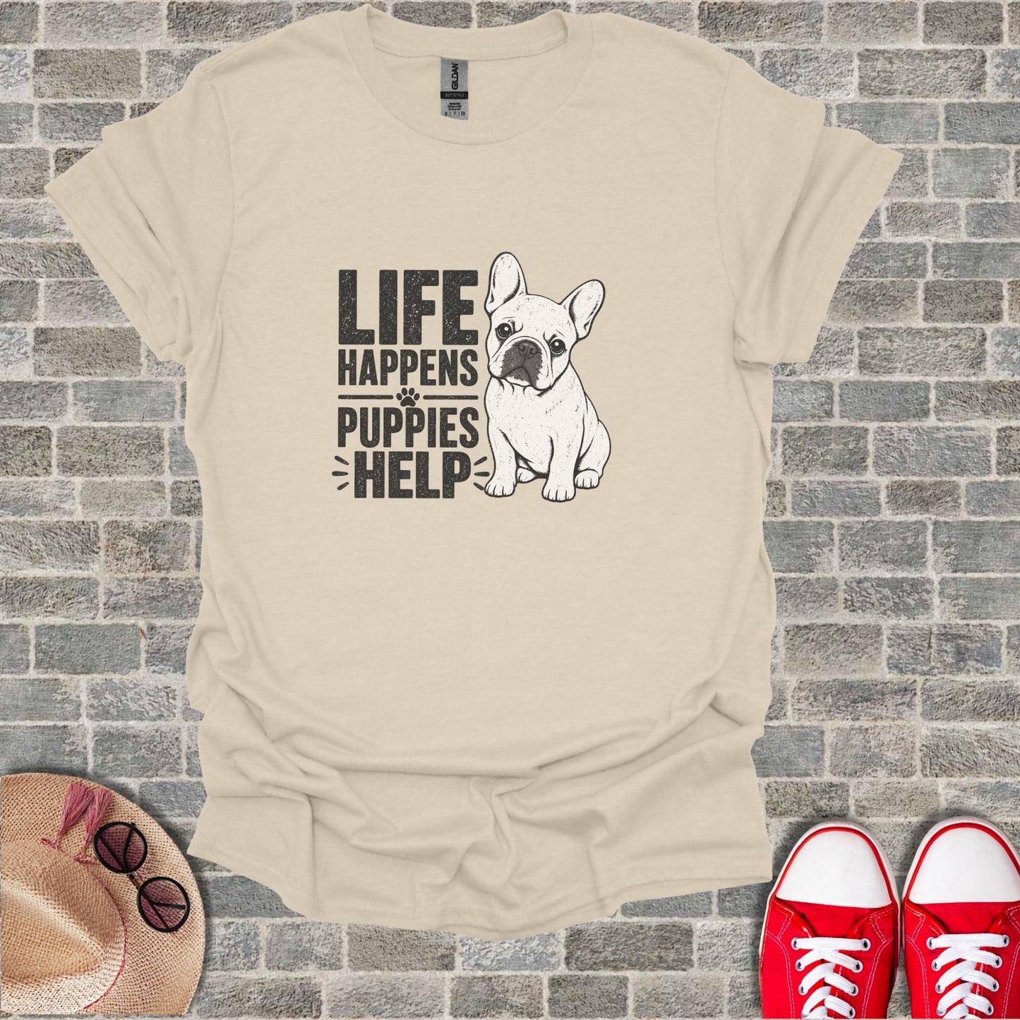 French Bulldog graphic tee with text "LIFE HAPPENS PUPPIES HELP".