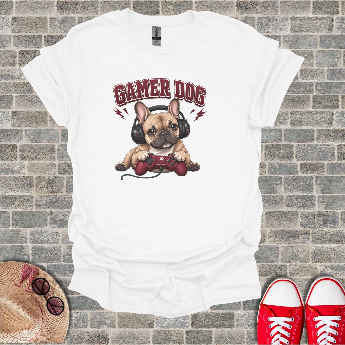 French bulldog wearing headphones and holding a video game controller.