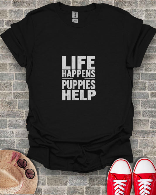 Black t-shirt with white text "LIFE HAPPENS PUPPIES HELP".