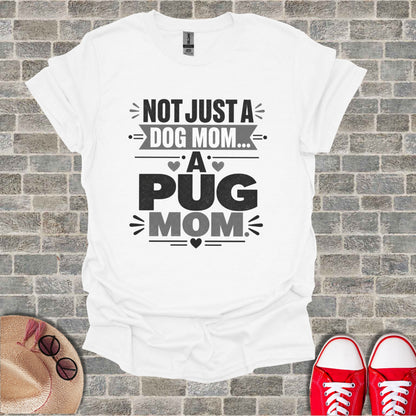 White t-shirt with "Not Just A Dog Mom... A Pug Mom" text and graphic design.