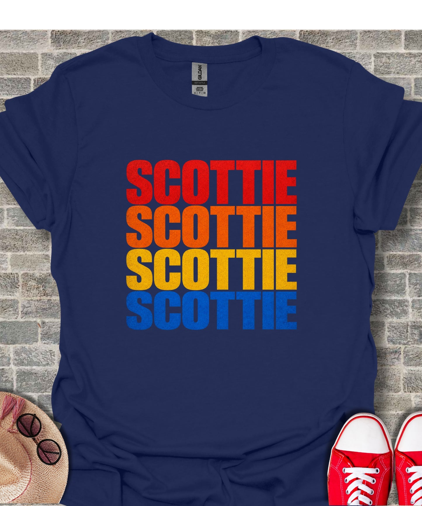 Navy t-shirt with stacked "SCOTTIE" text in red, orange, yellow, and blue.