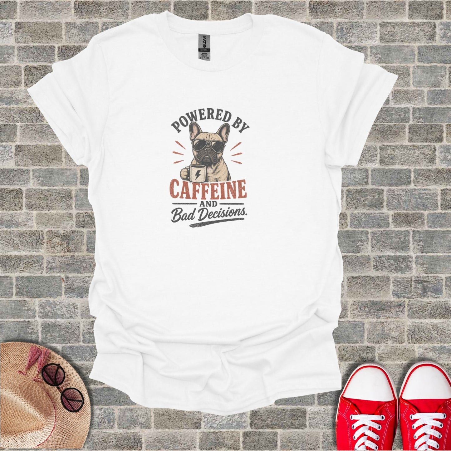 White t-shirt with French bulldog wearing sunglasses and text "Powered by Caffeine and Bad Decisions".