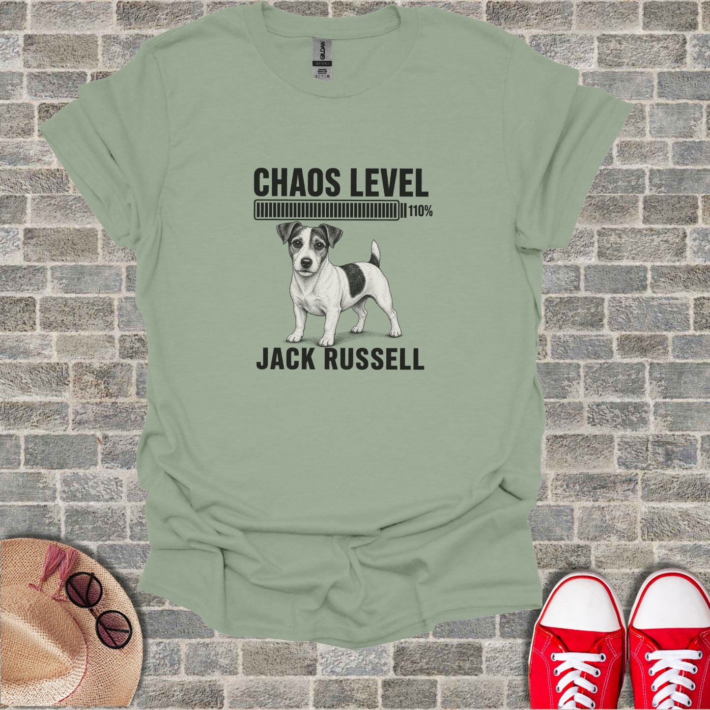 Jack Russell terrier with "Chaos Level 110%" text on a t-shirt.