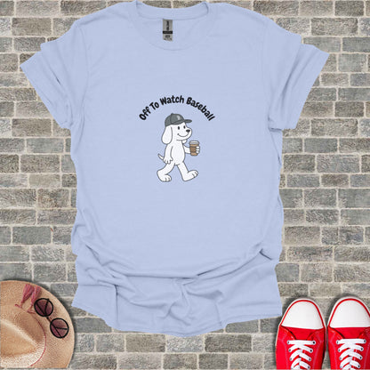 Light blue t-shirt with cartoon dog and text "Off To Watch Baseball".
