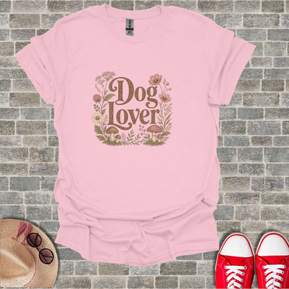 Pink t-shirt with "Dog Lover" text surrounded by flowers and mushrooms.