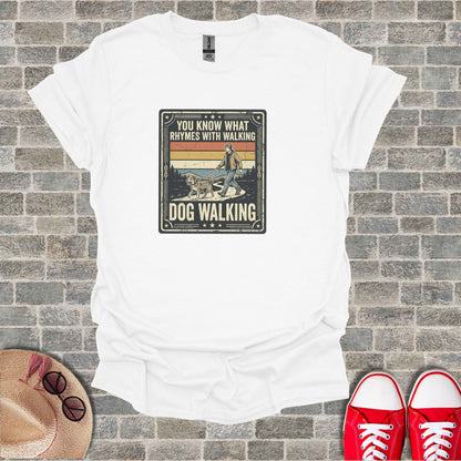 White t-shirt with vintage "Dog Walking" graphic featuring a person and dog.