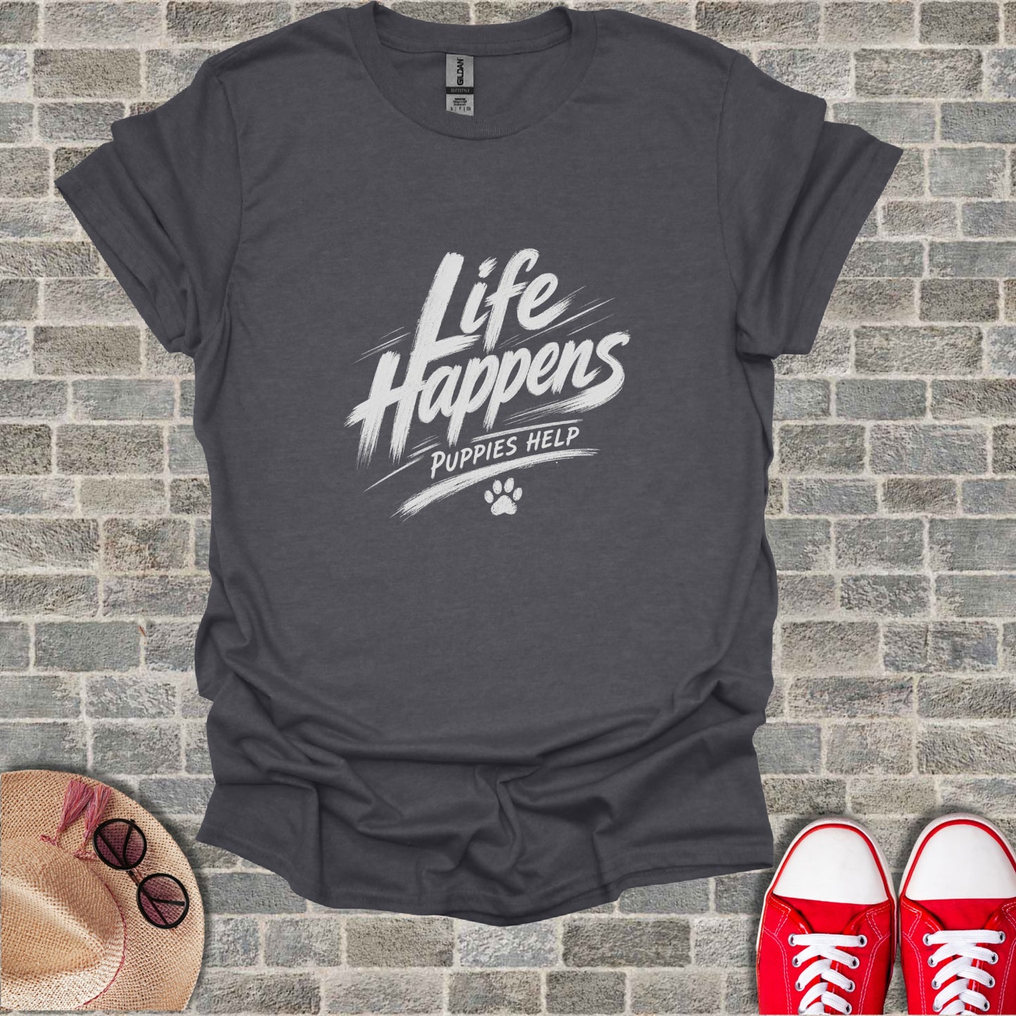 Dark grey t-shirt with white text "Life Happens Puppies Help" and paw print.