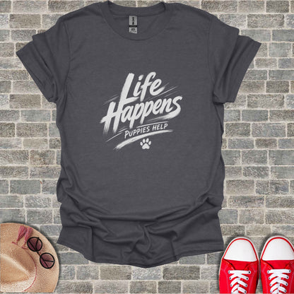 Dark grey t-shirt with white text "Life Happens Puppies Help" and paw print.